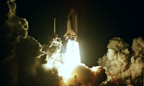 Dense layering of real events, technical language and US vernacular … a space shuttle launches.