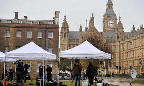 A picture shows news crews outside the H