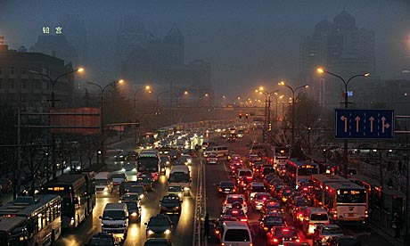 Hazy and polluted day in Beijing brings traffic to a halt 