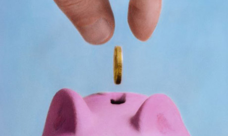 Putting money in a piggy bank