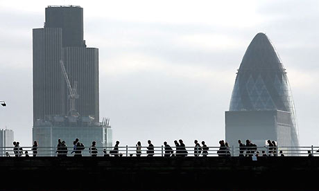 Commuters cross Waterloo Bridge to the City of London