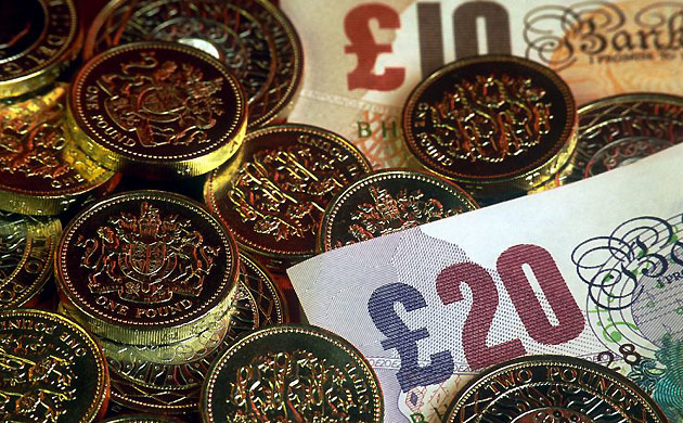 Money, cash, pounds. Photograph: Ann Pickford/Rex Features