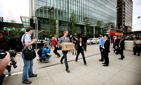 Lehman Brothers employees leaving the Canary Wharf building. Photograph: Graeme Robertson