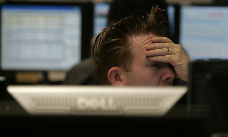 A trader reacts to the falling FTSE 100 at CMC Markets in London. Photograph: Alastair Grant/AP