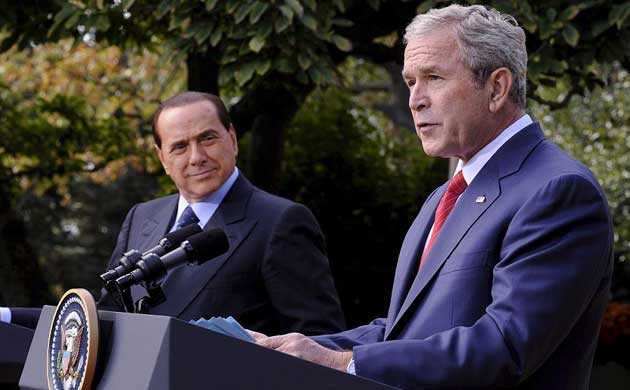 Silvio Berlusconi and George Bush address the media after meeting to discus the plunging business confidence across the globe