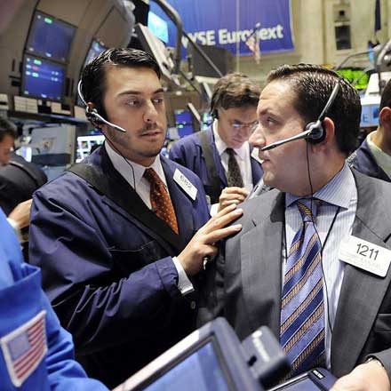 Traders in New York react to the  US government's plans to spend $250bn to buy stock in private banks