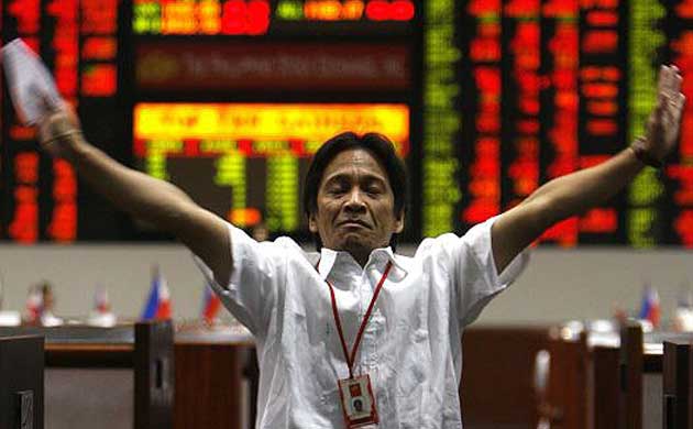A trader at the Philippines stock exchange as business is halted