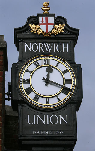 High street brands: The sign and clock outside the Norwich Union bank, Norwich, Norfolk