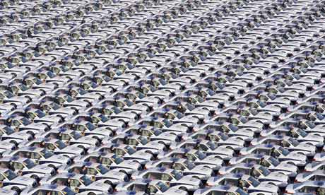 Chinese police officers stand alongside new vehicles during a handover ceremony in Taiyuan