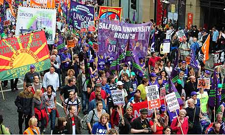 Demonstrators marching through Manchester as the Conservative Party conference opened in the city