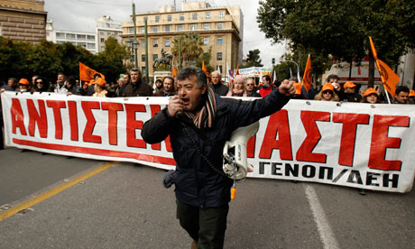 Members of Greece's public power corporation workers union march in Athens on February 9, 2012.
