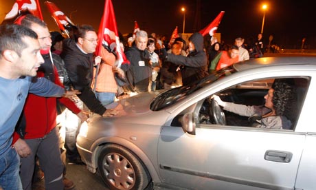 Trade union pickets block people who try to come into the Mercavalencia in Valencia, Spain.