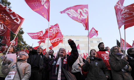 People demonstrate in front of the Gregorio Maranon Hospital in Madrid during a national strike.