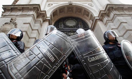 Carabinieri's police officers stand in front of the Bank of Italy's headquarters in Milan.