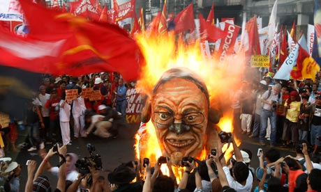 Protesters burn an effigy of Philippine President Benigno Aquino III on international Labour Day.