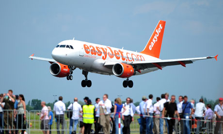 Spectators watch an Easyjet airplane land in Berlin