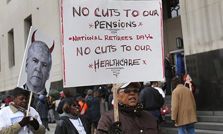 Protesters demonstrate against cuts to Detroit city workers' pensions and healthcare