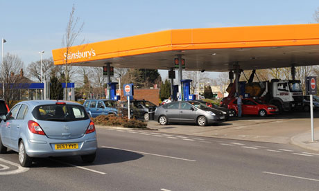 Drivers queue for petrol and diesel at a Sainsbury's supermarket filling station in Harrogate
