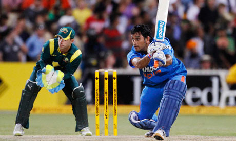 India's MS Dhoni plays a shot through the off-side as Australia's Matthew Wade looks on in Adelaide