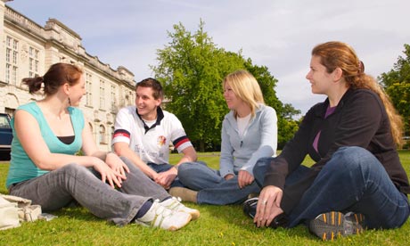 Students relax on grass