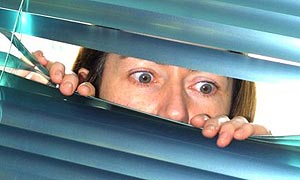 Parents spying on their children through a venetian blind