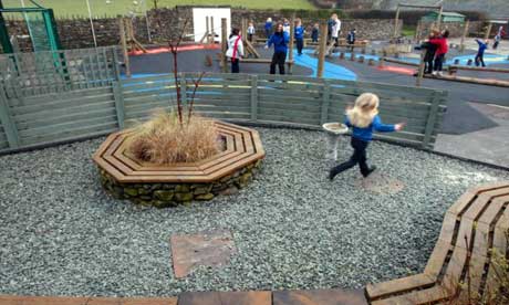 Children playing in the playground at Burlington primary school at Kirby-in-Furness in Cumbria