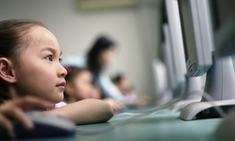 Schoolgirl working on computer