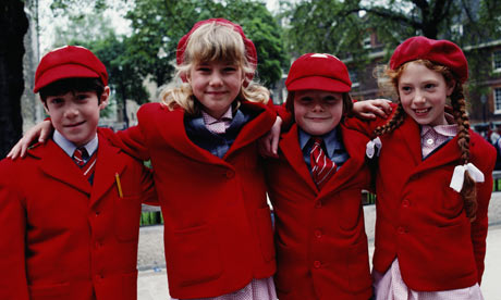 Four children in school uniforms