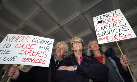 Carers protest outside Hammersmith town hall, London, about the closure of a carer centre