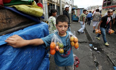 José, 13, sells fruit on buses in Guatemala City, but dreams of becoming a teacher