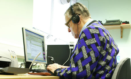 An elderly man uses a computer at the Resource Centre in Newham, east London