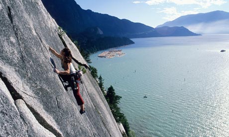 A woman student rock climbing in Canada