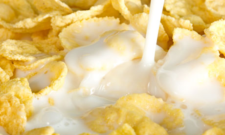 milk pouring on cornflakes