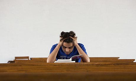 Male student reading a book