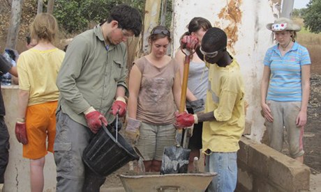 students volunteering in Gambia