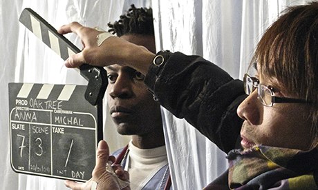 students with clapperboard