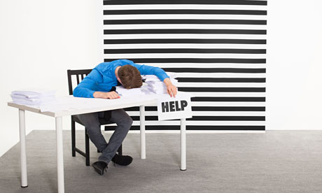 Office worker with sign that says help