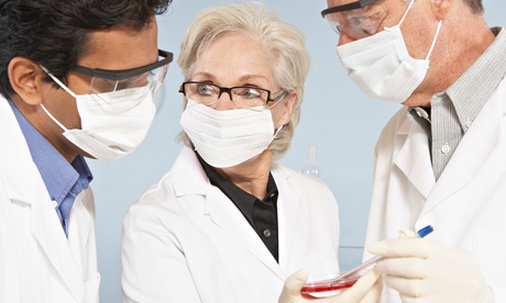 Scientists wearing surgical masks