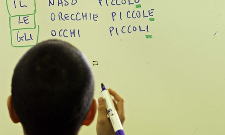 boy writing italian on whiteboard