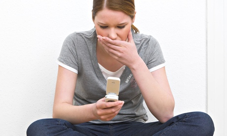 worried female student on mobile phone