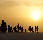 People watch the sun set over the dune 'Por do sol' or 'Dune of Sunset'