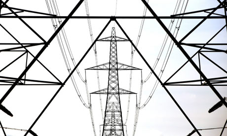 Climate Change And Global Pollution: A line of electricity pylons crosses the Essex countryside