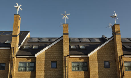 COP15 RENEWABLE ENERGY : Wind turbines sit atop a development of new houses, CROYDON