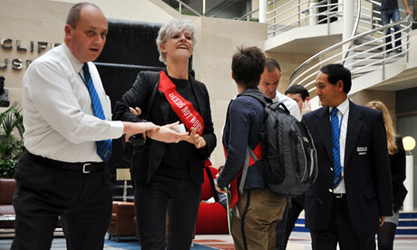 Three women from green activists Climate Rush are taken out the Daily Mail offices
