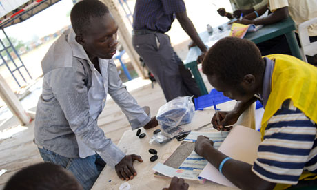 MDG : South Sudan Referendum : An official records the details of a voter in Juba South Sudan