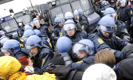 Police forces push back activists during a protest in Copenhagen on 16 December 2009 on the 10th day of the COP15 UN Climate Change Conference. Photograph: Adrian Dennis/AFP/Getty Images