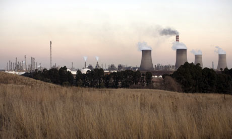 A Sasol coal-to-liquid fuel plant stands at dusk in Secunda, South  Africa