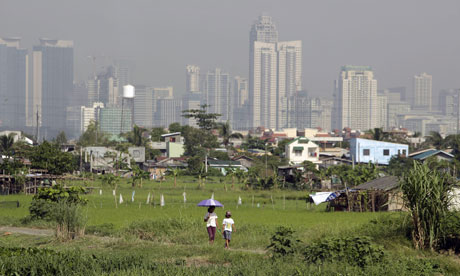 MDG Expanding urbanisation : the Makati skyline in Taguig city, east of Manila, Philippines
