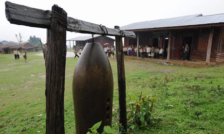 MDG : Laos : US bomb used as a bell at a primary school