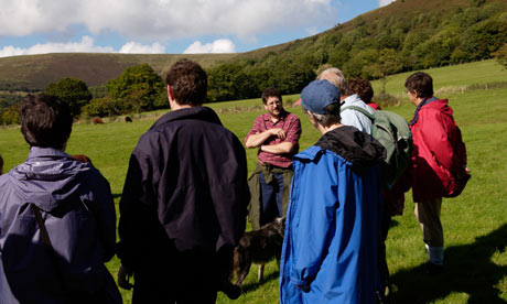 environmentally educational holiday Farm walk at an organic farm in Wales UK GB